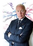Tony Buzan posing in front of a mindmap
